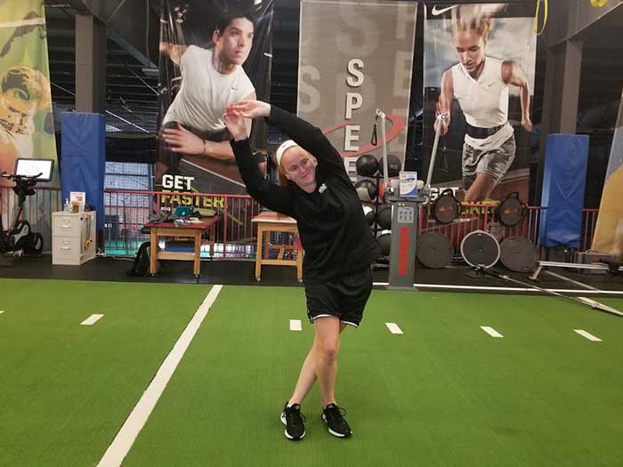 Young girl doing a warm-up exercise