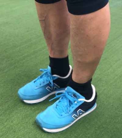 Man wearing blue shoes