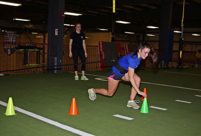 Girl undergoing training in the gym