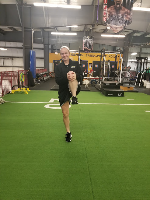 Girl doing Knee Hugs