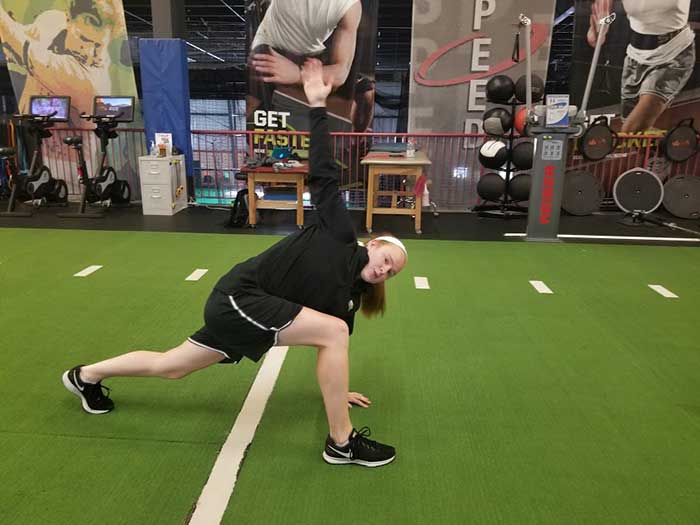 Girl doing Spiderman Lunge